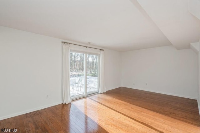 empty room featuring hardwood / wood-style flooring