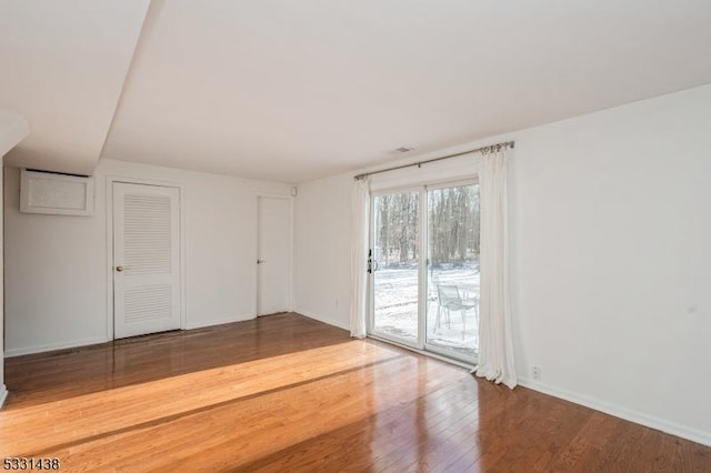 empty room featuring hardwood / wood-style flooring