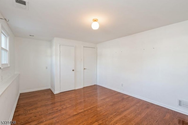 unfurnished bedroom featuring wood-type flooring