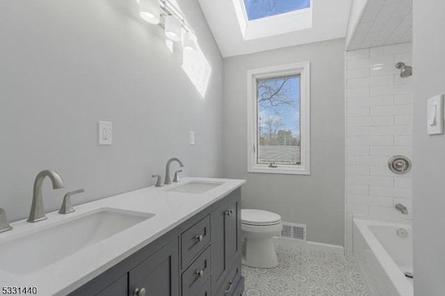 full bath with toilet, baseboards, visible vents, and a sink