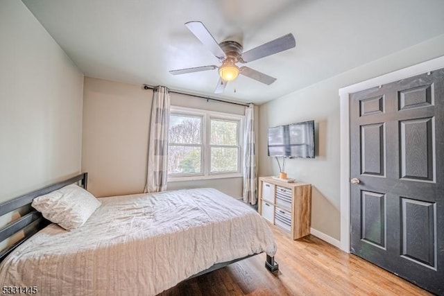 bedroom with ceiling fan and light hardwood / wood-style flooring