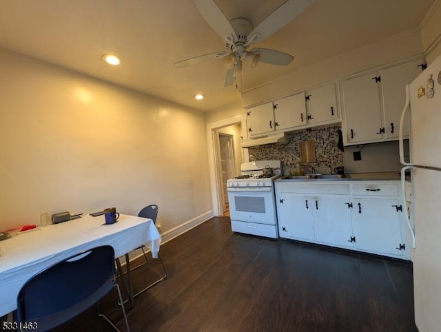 kitchen with white cabinetry, ceiling fan, dark hardwood / wood-style flooring, white appliances, and decorative backsplash