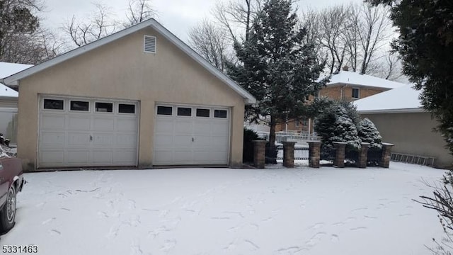 view of snow covered garage