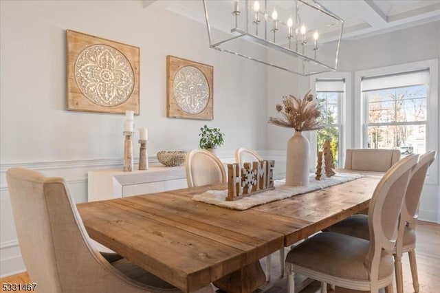 dining room with beamed ceiling, wood-type flooring, and coffered ceiling