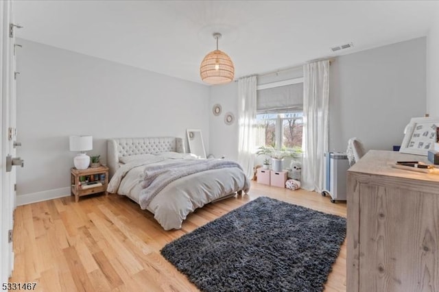 bedroom with light hardwood / wood-style floors