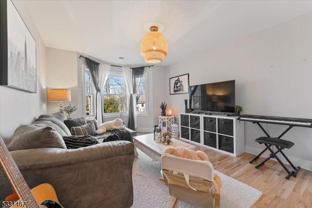 living room with light hardwood / wood-style floors