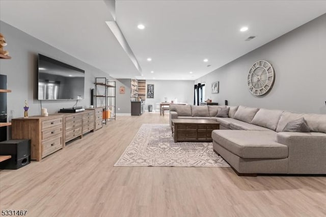 living room with light hardwood / wood-style floors