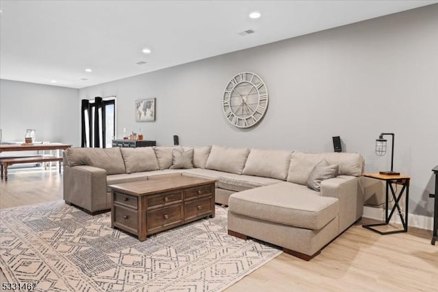 living room featuring light wood-type flooring