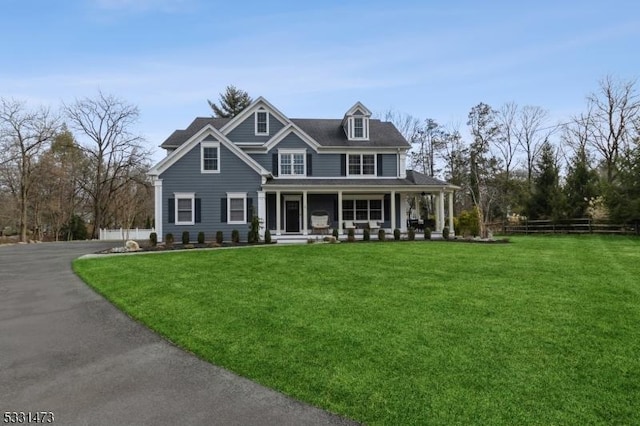 view of front of home featuring a porch and a front yard