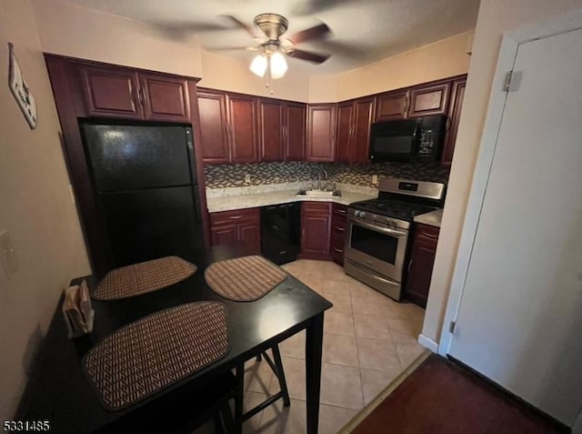 kitchen with black appliances, ceiling fan, light tile patterned floors, and tasteful backsplash