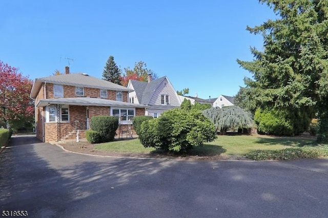 view of side of home featuring a lawn