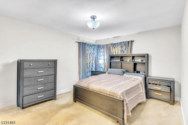 bedroom featuring light carpet