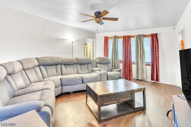 living room featuring ceiling fan and light wood-type flooring