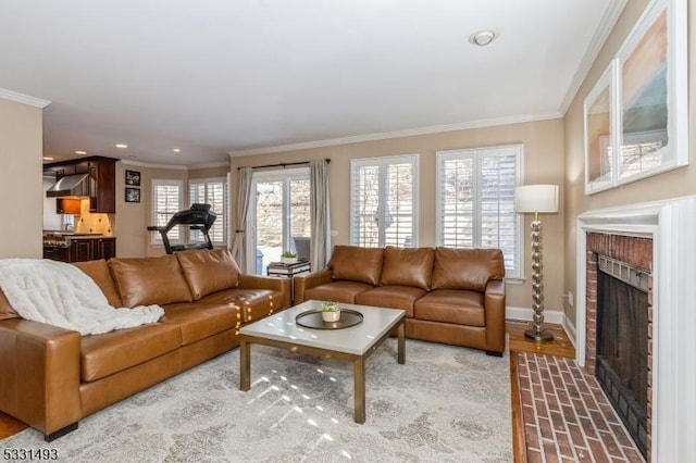 living room featuring a brick fireplace and ornamental molding