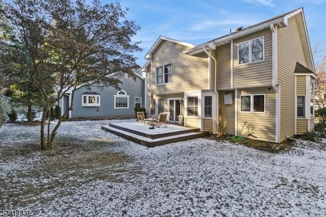 back of house with a wooden deck