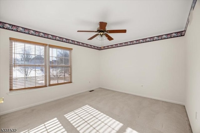 carpeted empty room with ceiling fan