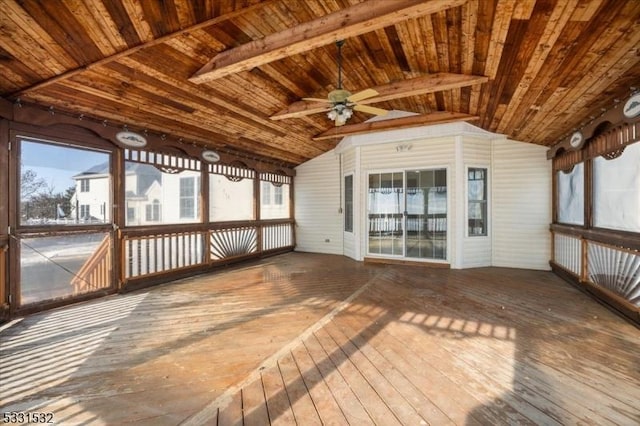 unfurnished sunroom with ceiling fan, lofted ceiling, and wood ceiling