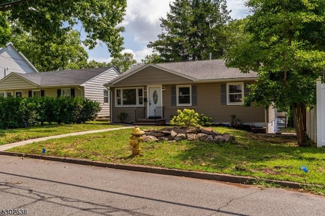 single story home with a front yard