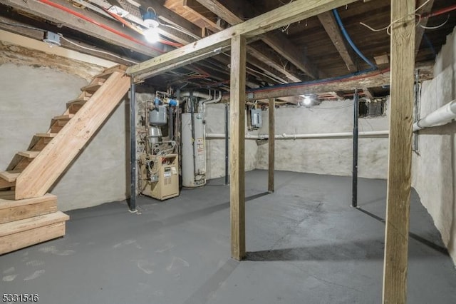 basement featuring electric panel and water heater