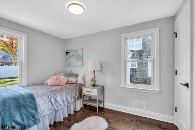 bedroom featuring dark hardwood / wood-style flooring