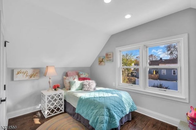 bedroom featuring dark hardwood / wood-style floors and lofted ceiling