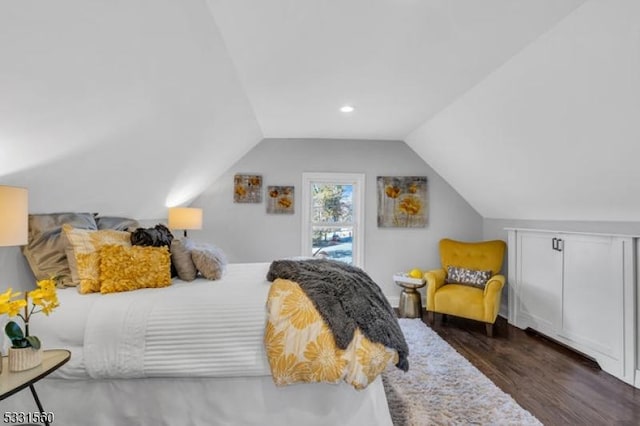 bedroom with dark wood-type flooring and vaulted ceiling