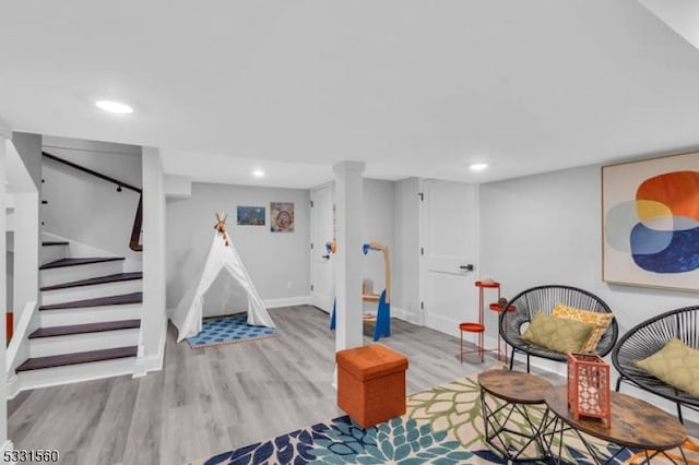 playroom featuring light wood-type flooring