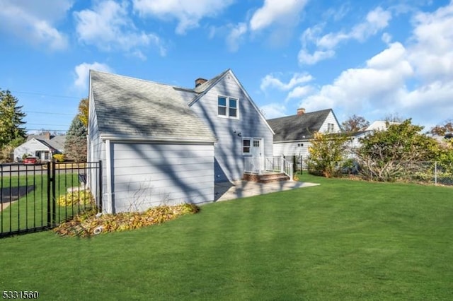 back of house featuring a yard