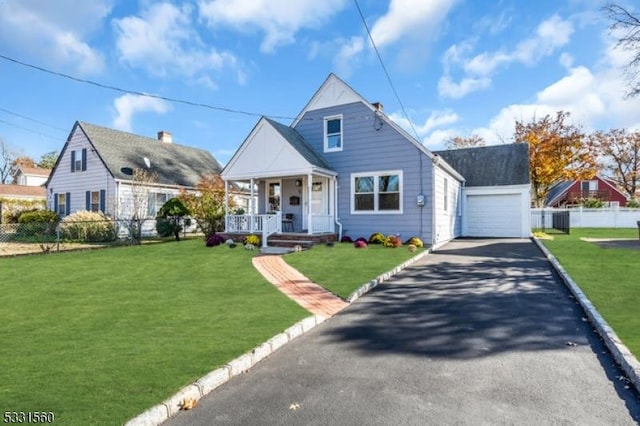 view of front of house with a garage and a front lawn