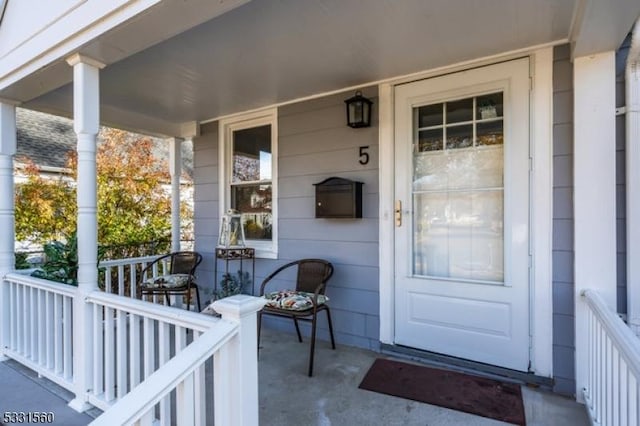 doorway to property featuring a porch