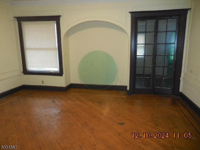 empty room featuring wood-type flooring