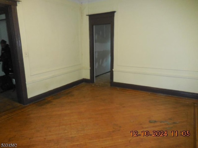 unfurnished room featuring hardwood / wood-style floors