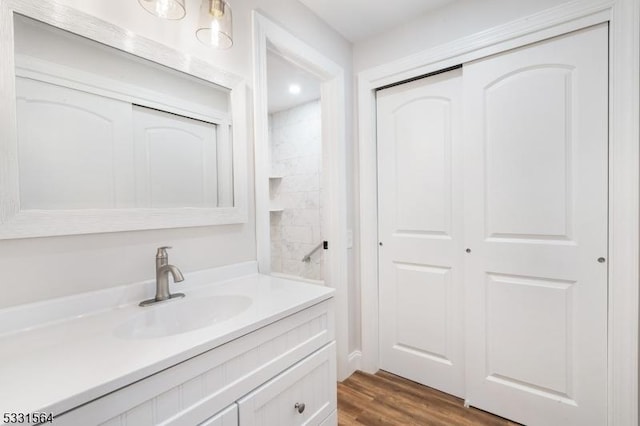 bathroom featuring vanity and hardwood / wood-style flooring