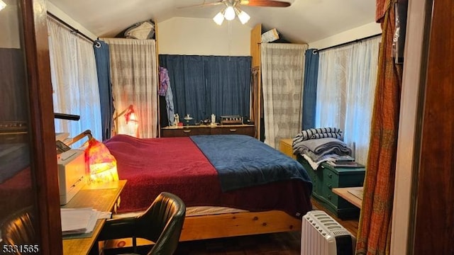 bedroom with radiator, ceiling fan, and vaulted ceiling