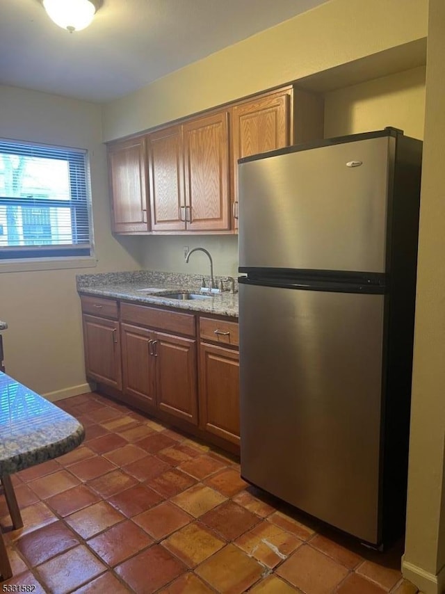 kitchen with stainless steel refrigerator and sink