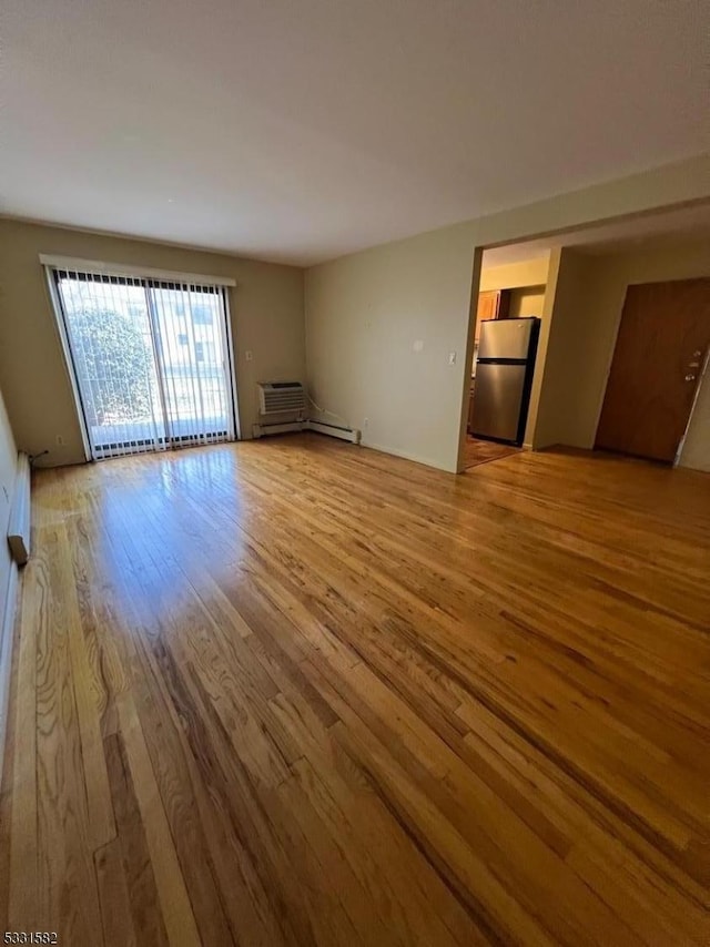 unfurnished living room featuring wood-type flooring