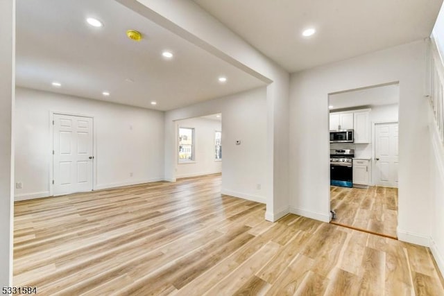 unfurnished living room featuring light hardwood / wood-style flooring