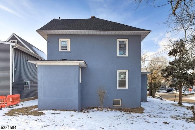 view of snow covered house