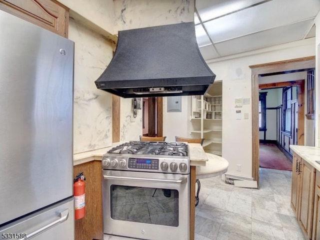 kitchen with extractor fan and appliances with stainless steel finishes