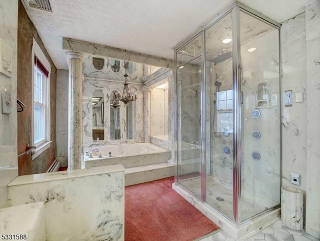 bathroom featuring ornate columns, plus walk in shower, and a notable chandelier