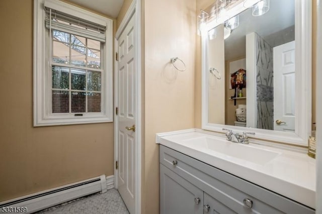 bathroom featuring vanity and baseboard heating