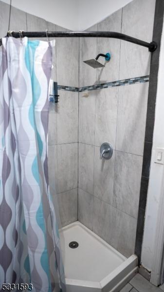 bathroom with a shower stall