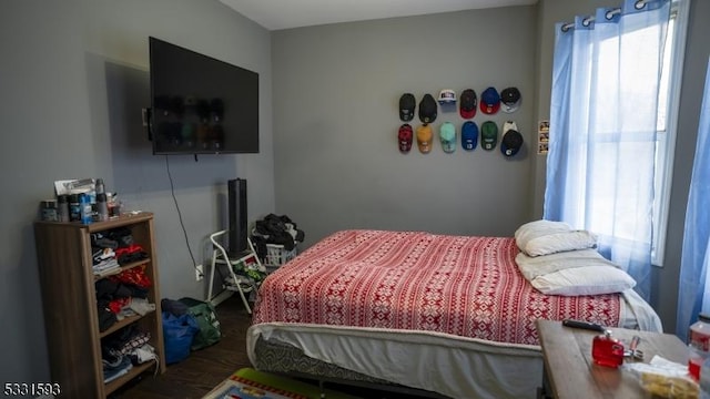 bedroom featuring wood finished floors