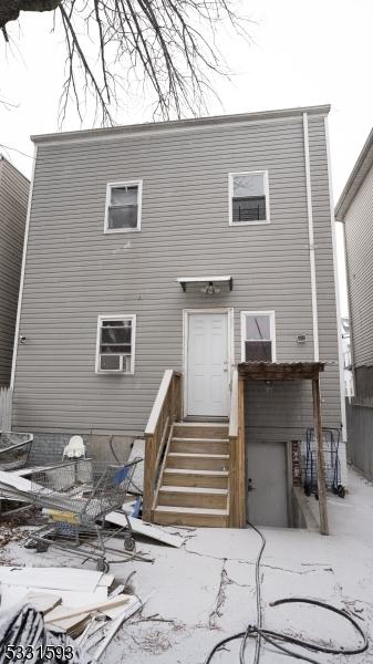 back of house with entry steps