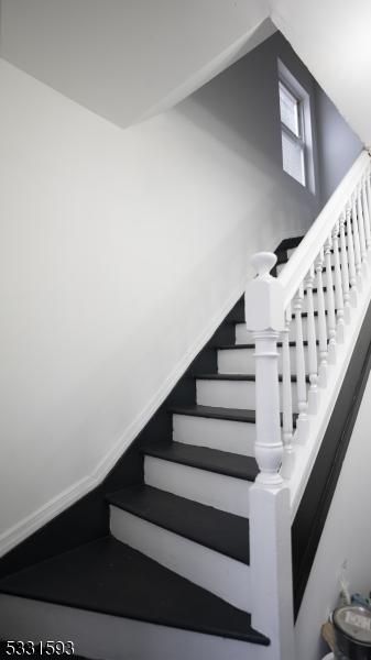 stairway with baseboards