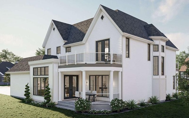 back of house featuring covered porch, french doors, a yard, and a balcony