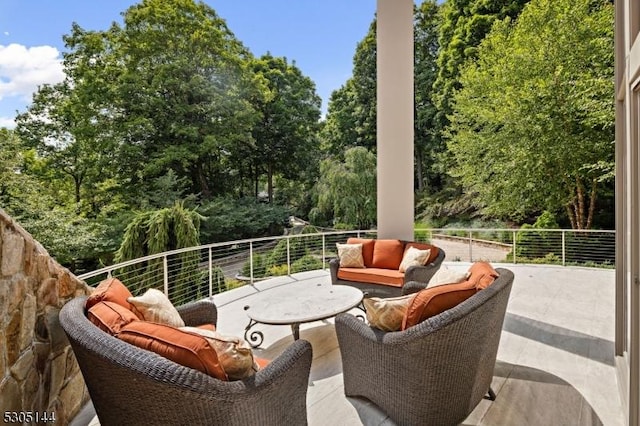 view of patio / terrace featuring a balcony and outdoor lounge area