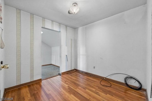 unfurnished room featuring wood-type flooring