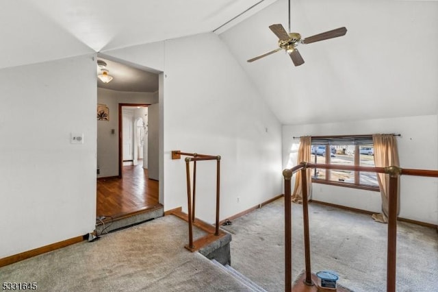 additional living space featuring carpet, ceiling fan, and vaulted ceiling