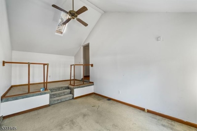 bonus room with ceiling fan, carpet floors, and lofted ceiling with skylight